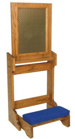 A large square board sits atop wooden legs with a padded place to kneel in front of the board.
