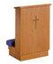  A blue kneeling pad connected to a wooden, rectangular shelf with a cross on the front.