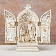 Image of the Holy Family Triptych opened to see the intricate paper-cut design.