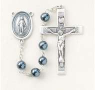 New England pewter rosary made with 6mm round genuine hematite beads with pewter Miraculous centerpiece and 1-3/4”crucifix. Handmade in the USA.  Presented in a deluxe velour metal gift box.
