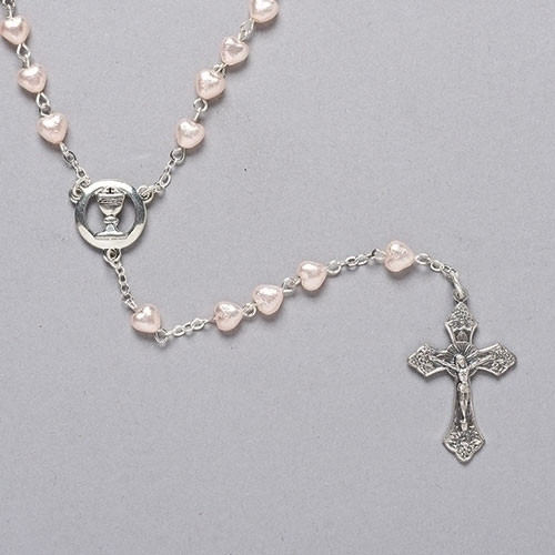 First communion 18"L Heart Rosary. Rosary is made of 6mm Pearlized Pink Heart Shaped Glass Beads. Centerpiece is a Chalice Comes in a velvet box. A wonderful keepsake for any girl making her communion to treasure forever.