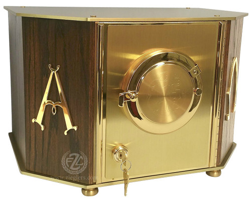Exposition Tabernacle Style 7130 Tabernacle brings an attractive and high quality made element to you altars repertoire. Made from a combination of Brass and Oak with polished Brass Alpha, Omega symbols. A satin inside lining has a linen texture contact material. Luna hold 2 3/4" host. Key with key lock. The Exposition door has an engraving of IHS. Holds 2 3/4" host.  Outside Dimensions: 15 5/8" wide, 10 1/2" depth, 10" high. Inside Dimensions: 13 1/2" wide, 8 1/2" depth, 9" high. Brass feet stand 1/4" high