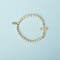 6" Gold Child's Pave CZ Cross Stretch Bracelet. Made of Glass and Brass. #2227553
