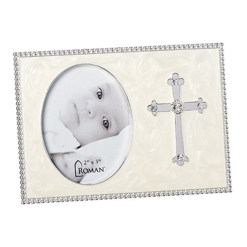 From the Caroline Collection comes this beautifully adorned Cross Photo Frame.  The Cross Photo Frame has a pearlized background and a lovely cross is mounted on the side of the photo. The Cross Frame measures 3.75"H and holds a 2" x 3" photo.  Perfect for a baptism gift!!