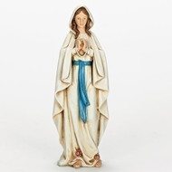 6" Our Lady of Lourdes Statue. Dimensions: 6.25"H x 2.25"W x 1.63"D. Resin/Stone Mix