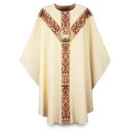 Chasuble made of beige Dupion, a knotted yarn dyed fabric of 70% man-made fibers and 30% viscose  adorned with a beautiful hand embroidered Agnus Dei emblem on a St. Andrew's Cross orphrey in Regina, a multicolored brocade on front and back. Plain "0" neck finish. Gothic Cut. Standard length is 53".