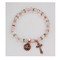 Copper/Crystal Rosary Bracelet. The copper and crystal rosary bracelet consists of copper plated beads, real crystal beads with crystal stone spacer beads, and a real crystal capped Our Father bead. A copper plated crucifix and miraculous medal are attached to the bracelet. Comes carded.