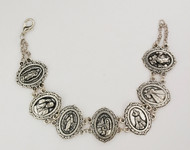 A Silver Oxidized Saint Bracelet. Saints include OL of Guadalupe, Miraculous Medal, OL Lourdes, Divine Mercy.