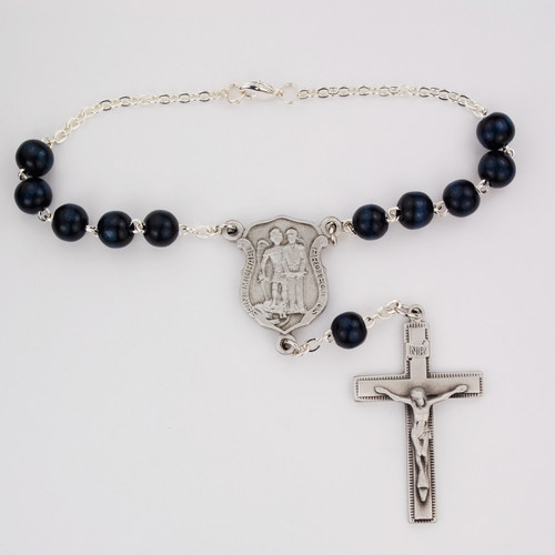 St. Micharl Auto Rosary. 8MM Blue wood beads with pewter police officer badge St Michael center and pewter crucifix. Comes on a hang tag. 