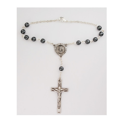 St Benedict Hematite Auto Rosary. 7MM hematite beads with silver oxidized crucifix and center. Comes on a hang tag. 