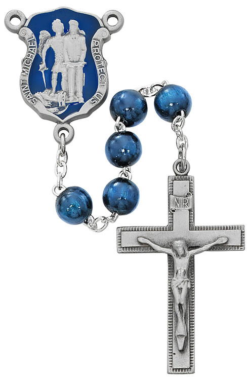 St. Michael Police Dark Blue beads and Enameled Centerpiece Rosary. 8MM dark blue wood beads make up this St. Michael's Police Badge Rosary. St Michael's police badge blue enameled centerpiece and crucifix are pewter. Comes in a deluxe gift box. 