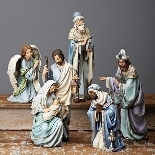 Blue Robe 15"H Nativity Scene. Set includes the Holy Family and the Three Kings. A simple and clean look by Joseph Studios.  This stunning Nativity scene features 5 figures wrapped in majestic, serene blue robes. A large scale set perfect for a foyer at home or a church’s entrance area at Christmastime. Set is made of resin and the measurements are 15"H x  22"W x 5.5"D.