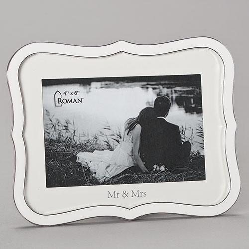 6.5"H White Weding Frame. Frame holds 4" x 6" photo. Wedding frame is made of zinc alloy and is lead free