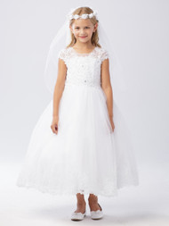 This communion dress has a lovely illusion neckline. The bodice of this dress is adorned with lace applique and rhinestones. The tulle skirt also has a lace applique hem
30 Day Return Police Internet ONLY!
3 Dress Limit per Order!