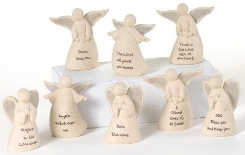 A cluster of eight white angel figurines displayed, each with a different phrase on their dress. 3.25H" "Faithful Angels" Each angel is approximately 3.25"H x 1.5"W x 2.5"D. The angels have different sayings. Please choose your saying. The angel figure is made of a resin/stone mix. A sweet token gift for someone special.  Each SOLD SEPARATELY