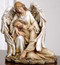 Angel with the Fallen Christ Figure. Material: Resin/Stone Mix. Dimensions: 7"H x 6.25"W x 5.75"D