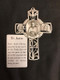 Pewter Cross with raised figures of St. Justin, Lamb, Bible and Holy Spirit. Prayer card included. Comes in a gift box.