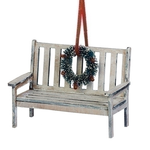 Bench with Wreath Ornament. 3" bench has a wreath on the back of chair. 3"H bench with wreath is made of medium density  fiberboard. Complete measurements are: 3"H x 4 "W x 2"D