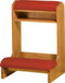 Square wooden structure with red pads for kneeling and resting one's arms.
 
