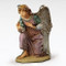 Full-color angel resting on one knee holding one hand to her heart. Fontanini 50" Kneeling Angel. Marble Based Resin
