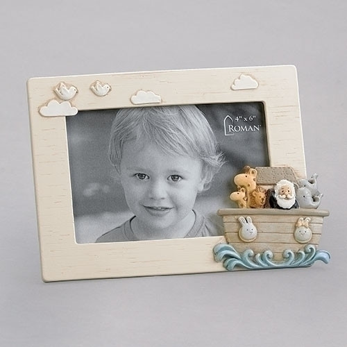 5.75"H "Noah's Ark" photo frame.  The photo frame has a conglomerate of animals in the ark on the on bottom right side of the Photo Frame. Frame is made of a resin stone mix. The 5.75" photo frame holds a 4" x 6" photo. 