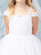 close up of girls First Communion dress with off the shoulder style, lace applique with sequins