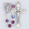 February - Amethyst 
These 6mm aurora borealis glass beads are available in each birthstone month color. Rosaries are 20" long. Rosaries have a silver oxidised Madonna centerpiece and Crucifix. Rosaries come in a clear top plastic box.  Perfect gift for any occasion.

