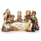 Image of children praying at a table in the Kid Pilgrim Scene tabletop decoration sold by St. Jude Shop.
