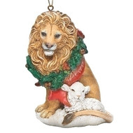 Christmas ornament of a lion with a wreath around its neck and a lamb by its side. 