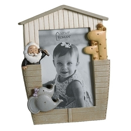 6"H "Noah's Ark" Ark shaped Photo Frame.  This Ark Shaped Photo Frame is adorned with elephants and giraffes on either side of the ark  frame. The Ark Shaped Frame is made of a resin/stone mix. The 6H" photo frame holds a 3.5H" x 3"W photo. 