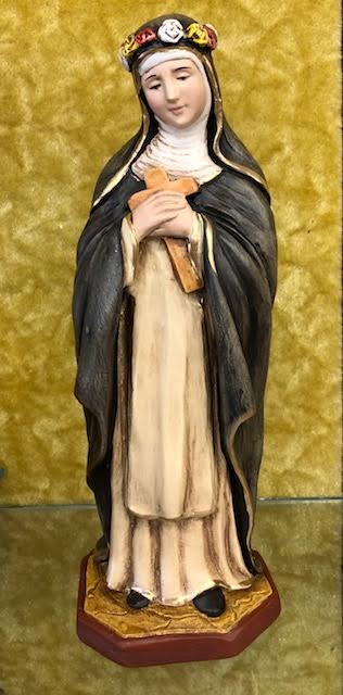 Saint Rose of Lima Statue by Liscano.  This statue of Saint Rose of Lima is made in Colombia, South America. The statue of Saint Rose of Lima has been beautifully hand painted by the Widows of Colombian Violence.It's measurements are  9"H  x 3" round diameter base.