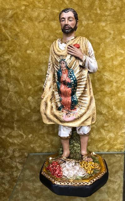 Juan Diego/Our Lady of Guadalupe Statue by Liscano.  This statue of Juan Diego is made in Colombia, South America. The statue of Juan Diego has been beautifully hand painted by the Widows of Colombian Violence.It's measurements are  9"H  x 3" round diameter base.