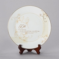 Porcelain 9"H 50th Wedding Anniversary Plate. This 50th Wedding Anniversary Plate stands 9"H and had gold scrolling. Plate comes with a stand. "Love does not look with the eyes, it sees with the heart. 50 years of marriage and a lifetime of love. Happy Anniversary" is written on the white and gold plate. Measurements are: 9.25"H 9.25"W 1"D. 