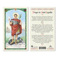 St Expedite Laminated Holy Card.  St. Expedite was a Roman centurion who was martyred for converting to Christianity. According to tradition, the Devil taking the form of a crow appeared to Expedite the day he decided to become a Christian, and told him to defer his conversion until the next day. Expeditus stamped on the bird and killed it, declaring, "I'll be a Christian today!" For this reason, he is known as the patron saint against procrastination, as well as emergencies and quick solutions. 

St. Expedite is depicted on the front of this laminated, full color prayer card as a Roman centurion, holding a palm leaf, a symbol of martyrdom, in his left hand, and raising a cross with the word hodie (today) on it in his right hand. His left foot is stepping on a crow, which is speaking the word "cras" (tomorrow). The back of the card has a prayer asking for St. Expedite’s intercession for a specific intention.