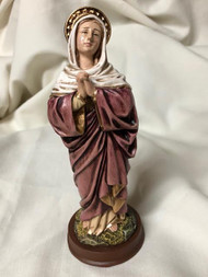 Our Lady of Sorrows Statue by Liscano.  This statue of  Our Lady of Sorrows statue is made in Colombia, South America. The statue of Our Lady of Sorrows has been beautifully hand painted by the Widows of Colombian Violence. It's measurements are  9"H  x 3" round diameter base. Shown in pink cloak