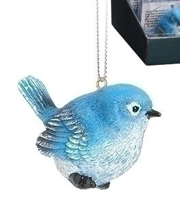 2.5" Bluebird of Happiness Ornament. The Blue Bird of Happiness is made of resin.  The blue jay resonates truth, faithfulness, and solidarity because they are vigilant in their tasks. They also keep the same mate for life, which is symbolic of endurance, patience and loyalty.  Card on back of the box reads:

"Let this little Bluebird hang on your tree, to remind you of the nest that shaped you into who you would be. Adventures and flights might keep you at a distance, but true happiness is found in a trip home for Christmas"