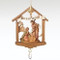Christmas ornament featuring the Holy family in a stable, a banner that reads ‘Silent Night’, and a dangling crystal. 