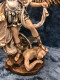 Beautifully detailed St Michael the Archangel Statue by Liscano. This statue of St Michael the Archangel is made in Colombia, South America. The statue of St Michael the Archangel has been beautifully hand painted by the Widows of Colombian Violence. It's measurements are  9"H  x 3" round diameter base.