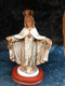 Our Lady of Mercy Statue by Liscano.  This statue of  Our Lady of Mercy statue is made in Colombia, South America. The statue of Our Lady of Mercy has been beautifully hand painted by the Widows of Colombian Violence. It's measurements are  9"H  x 3" round diameter base.