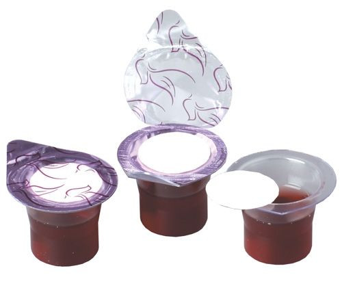 Image of three grape juice filled communion cups with decorative seals.