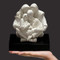 An intimate depiction highlighting the sanctity of the family including the loving stability that grandparents offer our future generations. This solid resin-stone cast is left in its natural Carrara white color and is mounted on a solid matt black base. Timothy personally sculpts every original small masterpiece complete with his signature or monogram. Each replica is detailed by hand to the exacting standards of this modern day master sculptor.  Miniature Replica : (7.25″h x 5.75″w x 6.75″d)