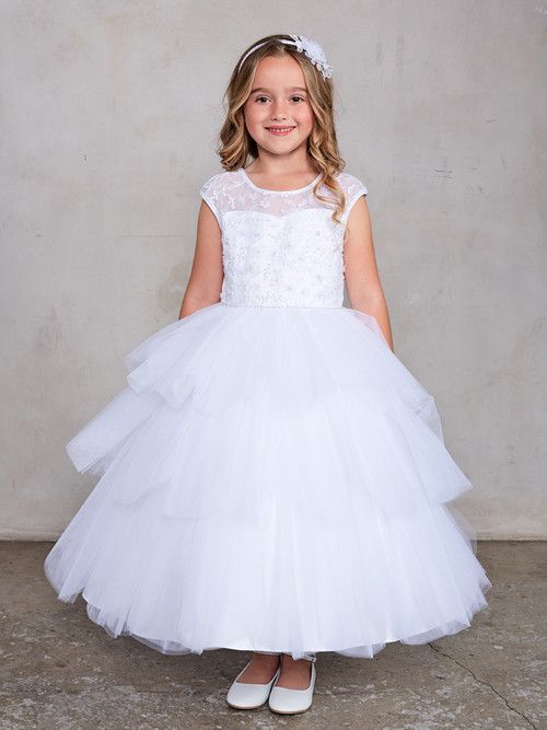 girls layered tulle communion dress with illusion neckline and sash tie back.
Illusion neckline lace bodice with cap sleeves
Pearl accent on the waist
Layered scalloped mesh skirt
Rear center zipper and sash tie back
Ankle length
