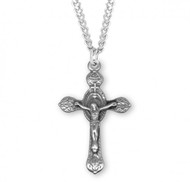 Sterling Silver Monstrance Style Crucifix Pendant. Solid .925 sterling silver.  Crucifix Pendant comes on a 24" genuine rhodium plated curb chain.  Dimensions: 1.5" x 0.9" (39mm x 23mm). Weight of medal: 2.8 Grams. Comes in a velvet gift box. Made in the USA