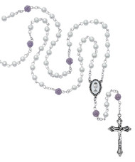 Holy Communion Rosary. This Holy Communion Rosary is made with 5mm white pearl beads and 6mm Our Father purple flower beads.  Rosary has a chalice center piece. Rosary comes in a deluxe gift box! 