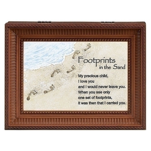 "Footprints in the Sand" Brown Wood Wind up Music Box. Music Box plays "Nocturne". Saying reads: "My Precious Child, I love you and would never leave you. When you see only one set of footprints, It was then that I carried you." Measurement: 8"L X 6"W X 3"H. Made of Plastic and Metal.