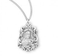 St Therese of Lisieux Fancy .925 Sterling Silver Medal.  Dimensions: 0.8" x 0.6" (21mm x 15mm).   Weight of medal: 2.9 Grams. Medal comes on an 18" Genuine rhodium plated curb chain.  Made in USA. Deluxe velvet gift box included. Engraving available. 
