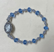 7 1/2" Adult Blue Lourdes Stretch Bracelet.  Our Lady of Lourdes medal is an oxidized silver. Bracelet comes carded.  Made in the USA!