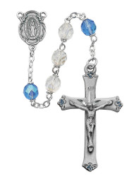  7MM Blue and Crystal Beads Rosary. Center and Crucifix are made of pewter. Gift box included. Made in the USA