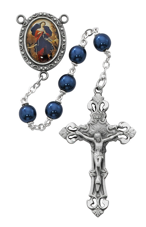 7mm Blue Pearl Glass Beads Rosary with rhodium plated pewter Crucifix and OL of Knots Center. Rosary presents in a deluxe gift box.  Made in the USA.
