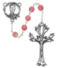Pink Tincut Beads Rosary has a rhodium plated pewter Crucifix and Center.  19" in Length. Deluxe Gift Box Included. Made in the USA